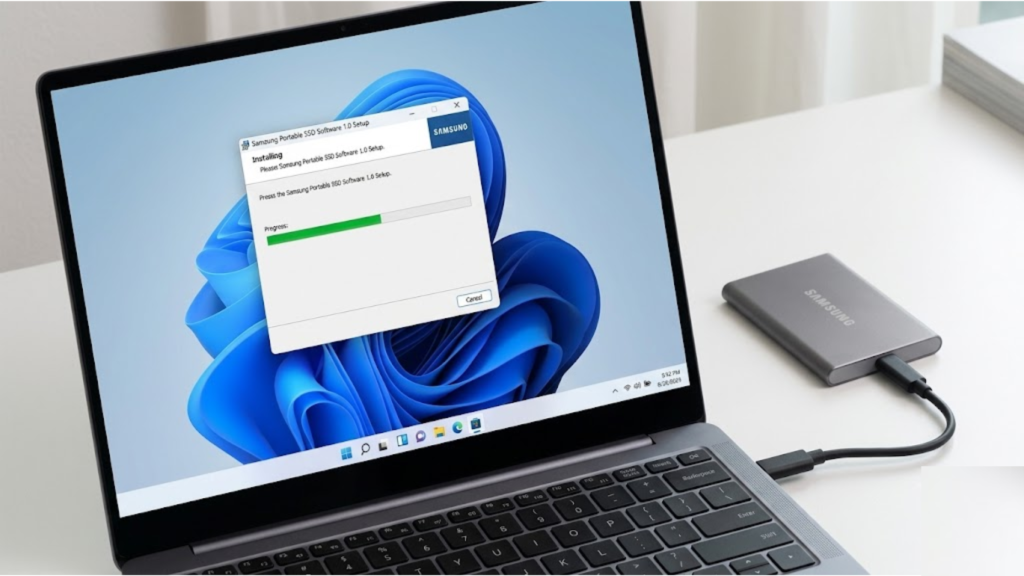 Windows 11 laptop showing the Samsung Portable SSD Software 1.0 installation progress bar with a Samsung SSD connected